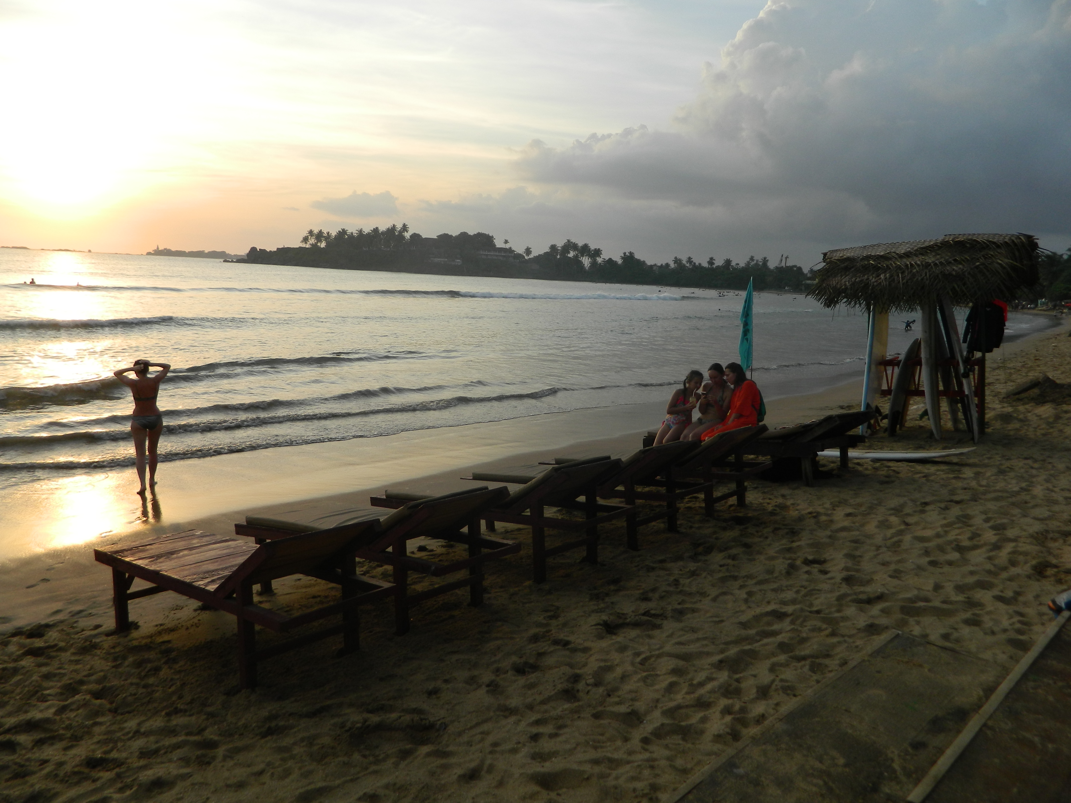 Surf instructor teaching a student on Dewata Beach
